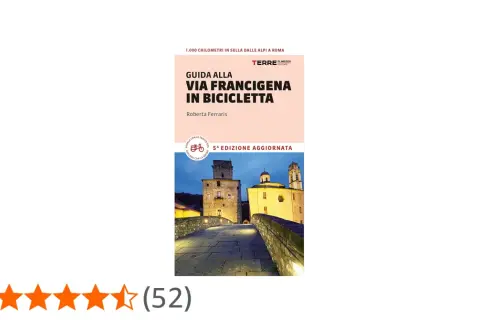 Guida alla Via Francigena in bici, un percorso di 1.000 km dalle Alpi a Roma. Immagine di un ponte medievale illuminato.