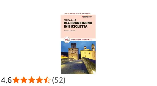 Guida alla Via Francigena in bici, un percorso di 1.000 km dalle Alpi a Roma. Immagine di un ponte medievale illuminato.